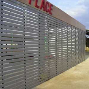 Linear sun louver system on commercial building façade in Goa