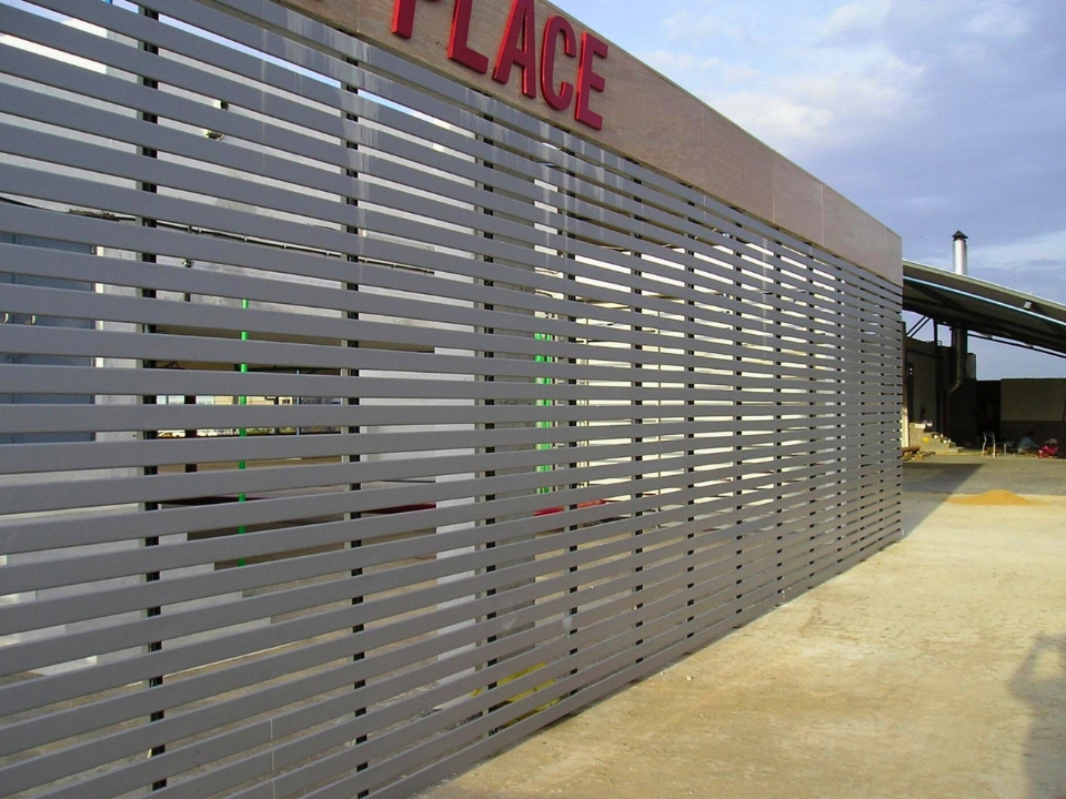 Linear sun louver system on commercial building façade in Goa